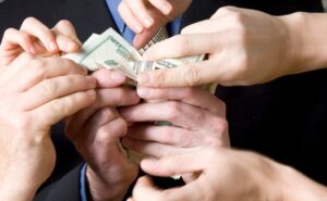 hands grasping money
